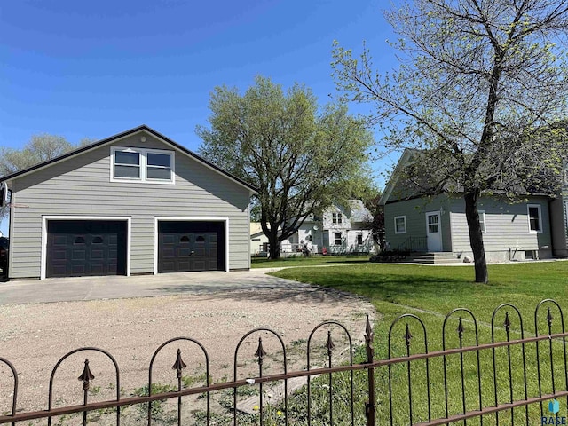 garage featuring a lawn