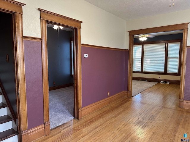 unfurnished room featuring ceiling fan and light wood-type flooring