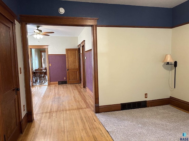 corridor featuring light wood-type flooring