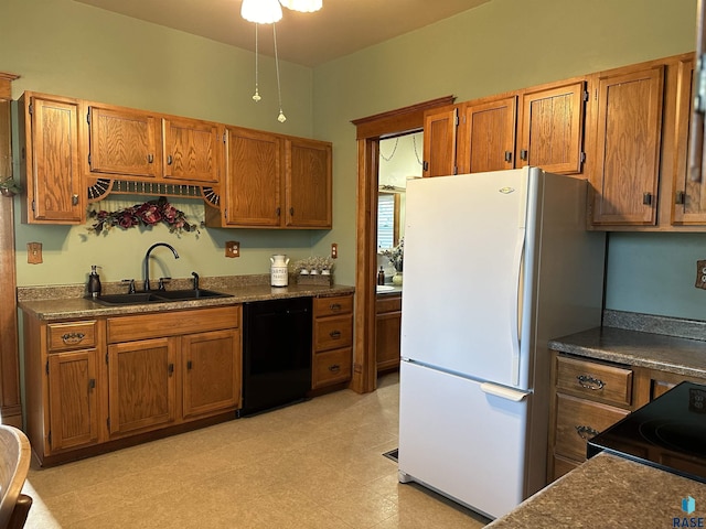 kitchen with dishwasher, electric range oven, white fridge, and sink