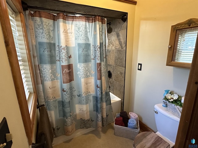 bathroom with shower / bath combo and toilet