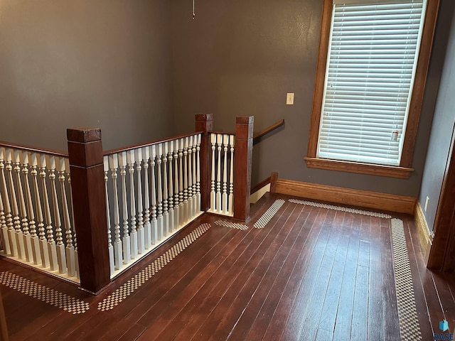 stairway featuring hardwood / wood-style flooring