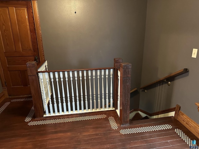 stairs with wood-type flooring