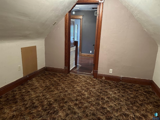 bonus room with carpet and lofted ceiling