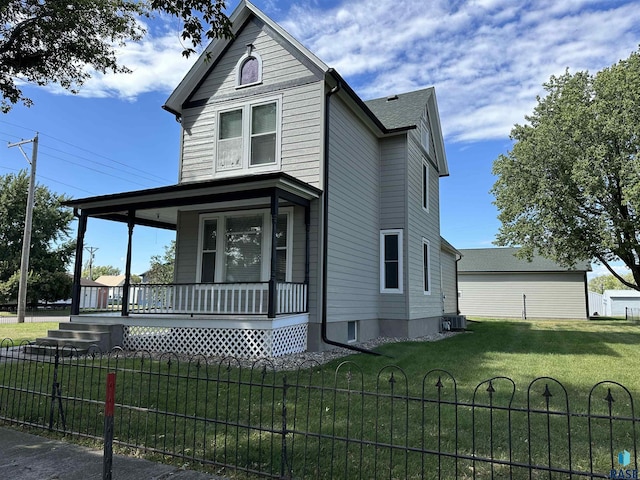 view of front of home featuring a front yard and a porch