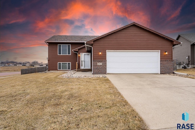 view of front facade featuring a yard and a garage