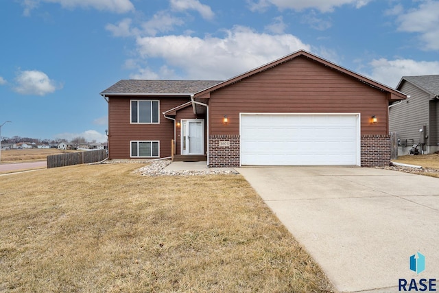 view of front of house with a garage and a front lawn