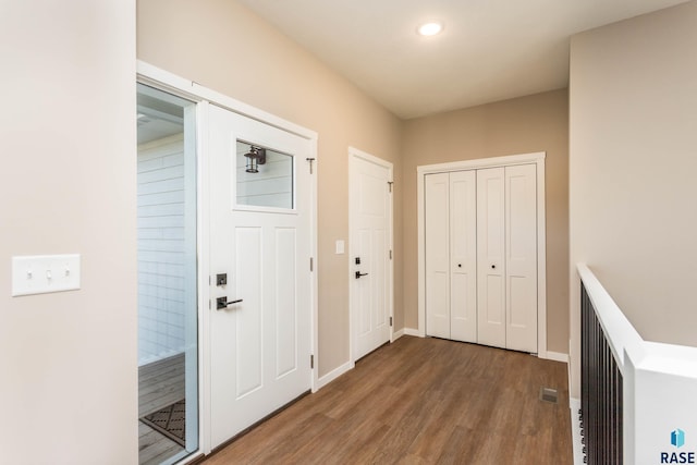 corridor featuring hardwood / wood-style flooring