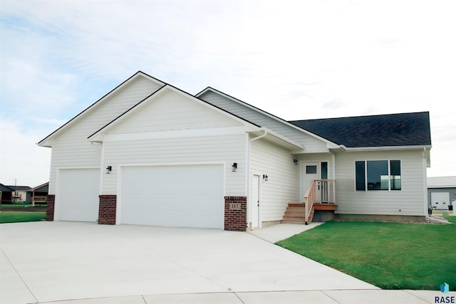 ranch-style house featuring a front yard and a garage