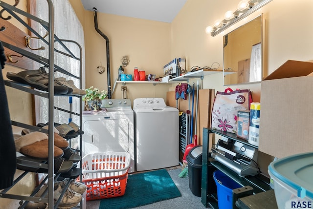 washroom featuring washing machine and clothes dryer and carpet floors