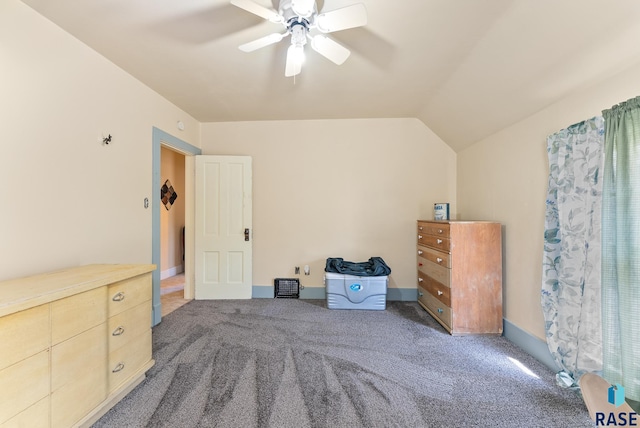 carpeted bedroom with ceiling fan and lofted ceiling