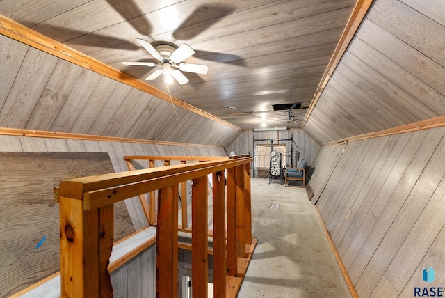 additional living space featuring light carpet, vaulted ceiling, ceiling fan, wooden walls, and wooden ceiling