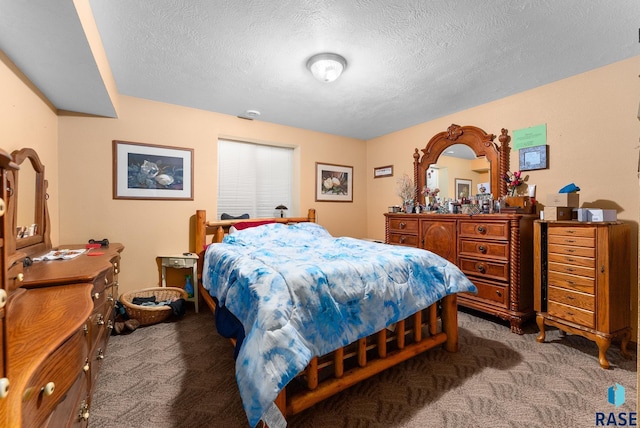 carpeted bedroom with a textured ceiling