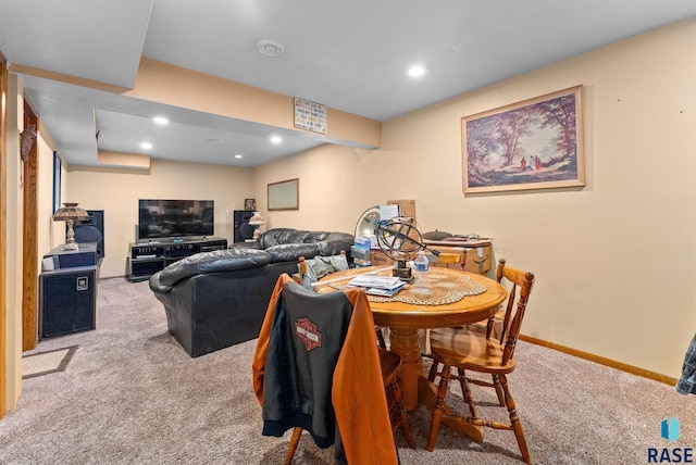 dining space featuring carpet