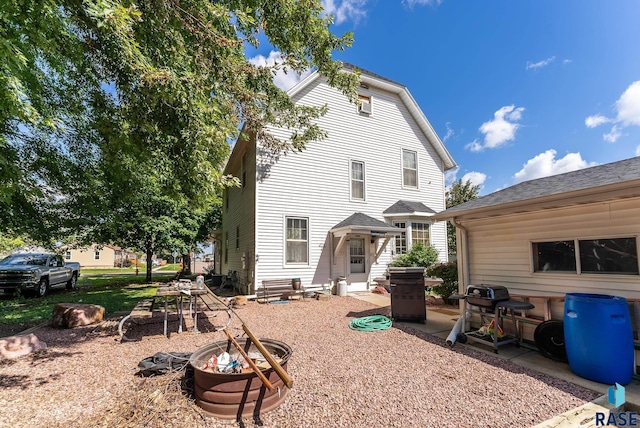 rear view of house featuring a patio