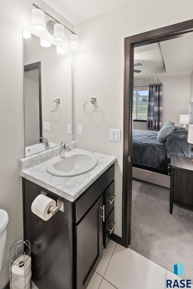 bathroom with tile patterned flooring and vanity