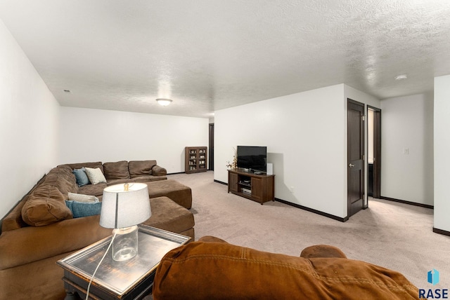 living room featuring light colored carpet and a textured ceiling