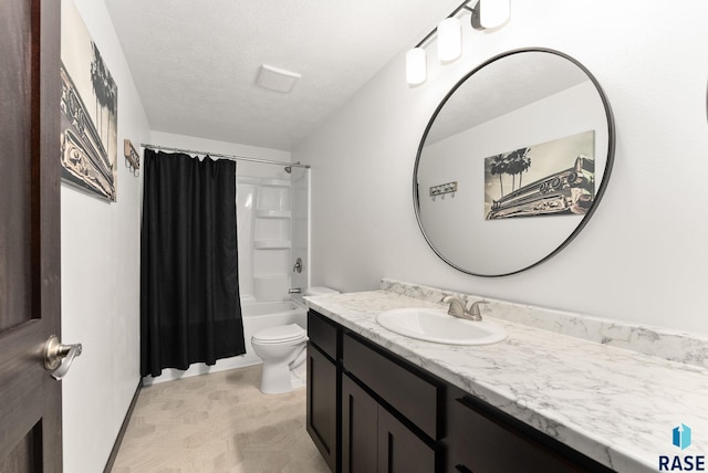 full bathroom featuring vanity, toilet, shower / bathtub combination with curtain, and a textured ceiling