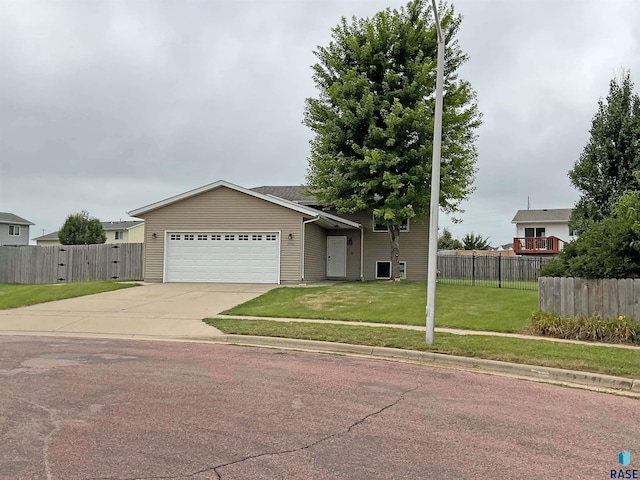 single story home with a garage and a front lawn