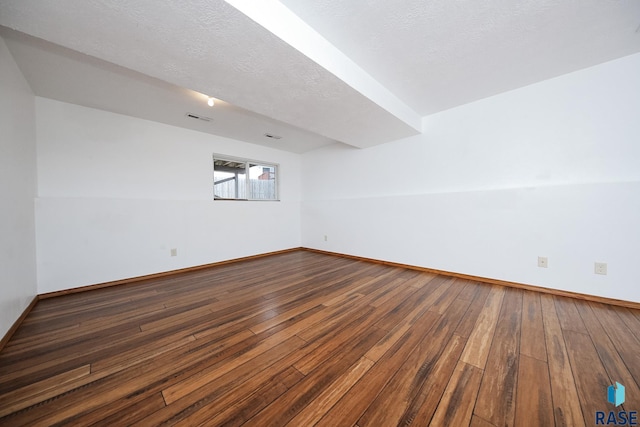 interior space featuring hardwood / wood-style floors and a textured ceiling