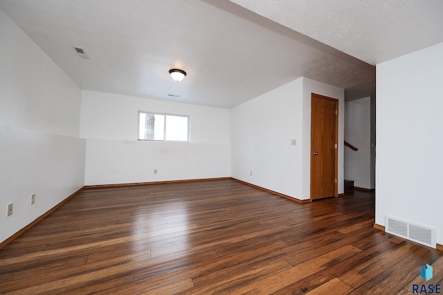 spare room featuring dark hardwood / wood-style floors