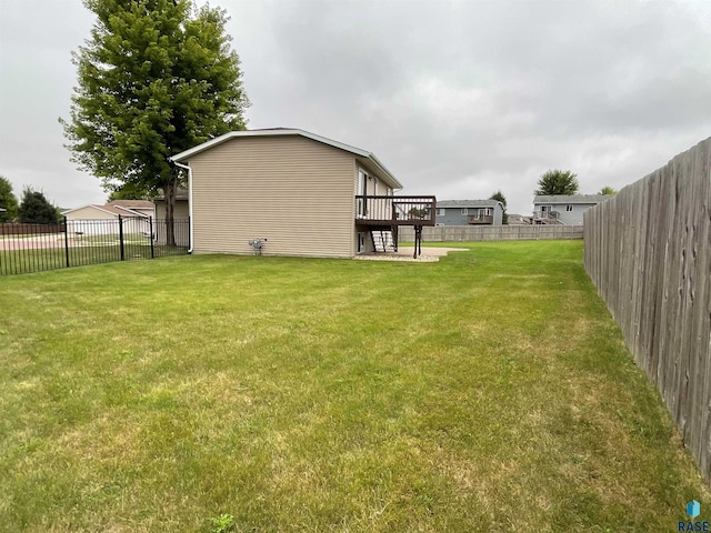 view of yard featuring a wooden deck