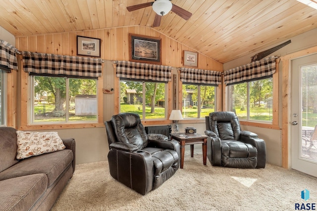 sunroom / solarium with vaulted ceiling, ceiling fan, and wooden ceiling