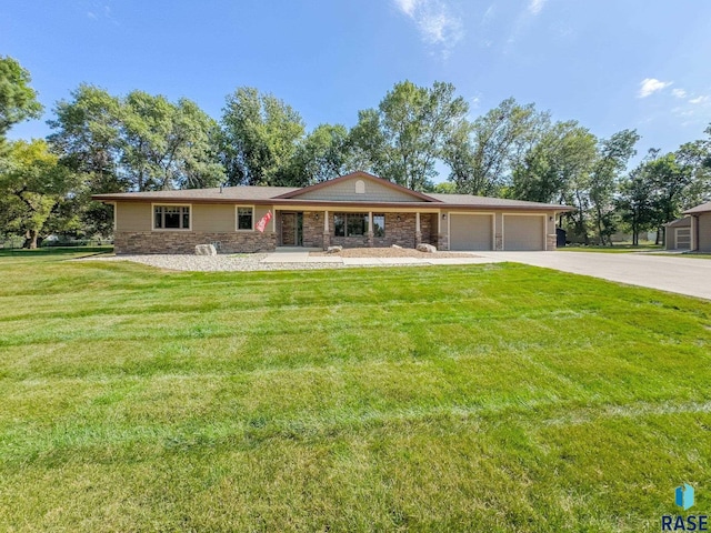 ranch-style house with a garage and a front yard