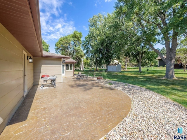 view of patio with a storage unit