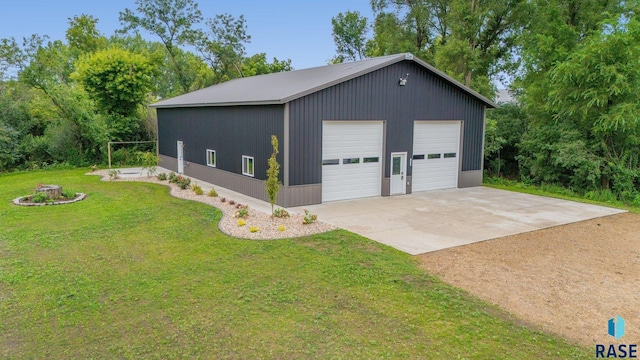 garage featuring a lawn