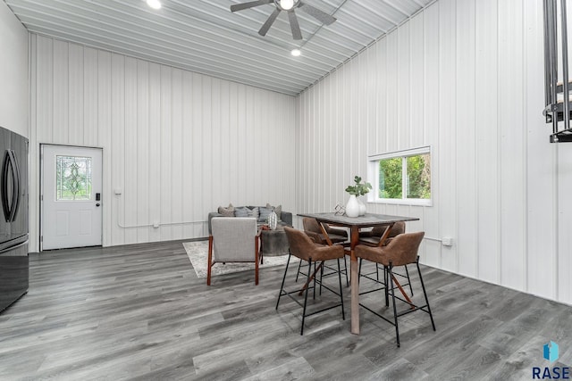 dining room with ceiling fan and hardwood / wood-style floors