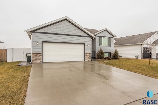 view of front of property with a front lawn and a garage