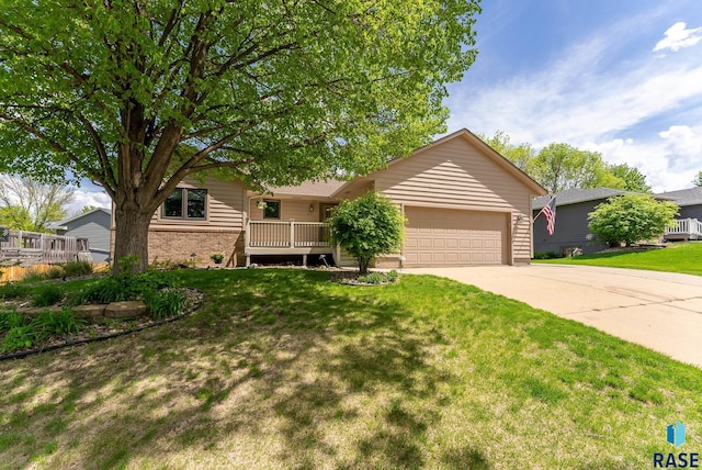 view of front of house with a front yard and a garage