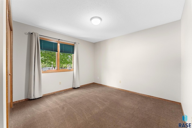 unfurnished room with carpet floors