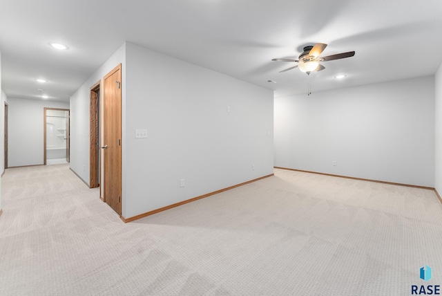 carpeted empty room featuring ceiling fan