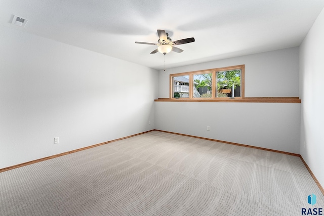 carpeted empty room with ceiling fan