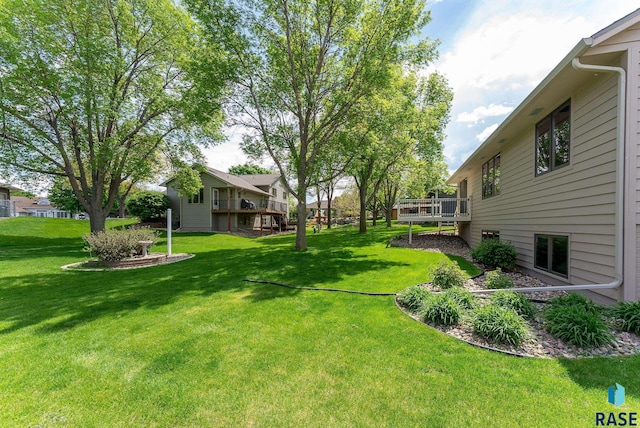 view of yard featuring a wooden deck