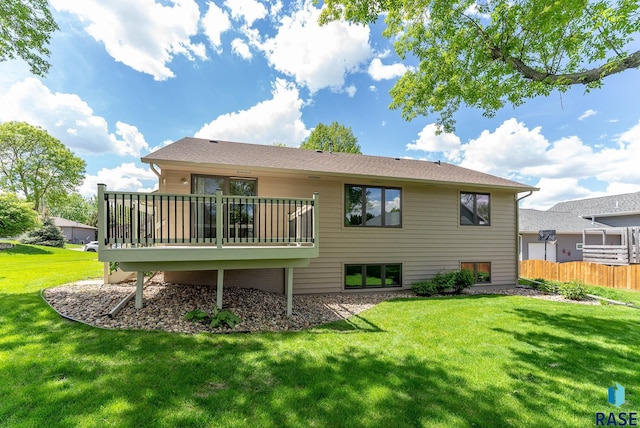 rear view of property with a yard