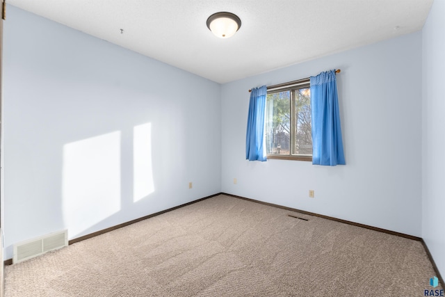 empty room featuring carpet floors