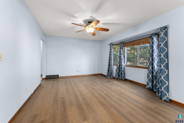 unfurnished room with light hardwood / wood-style flooring and ceiling fan