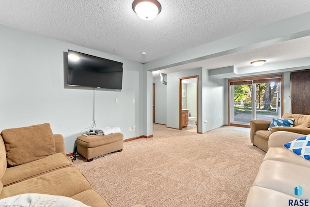 carpeted living room featuring a textured ceiling