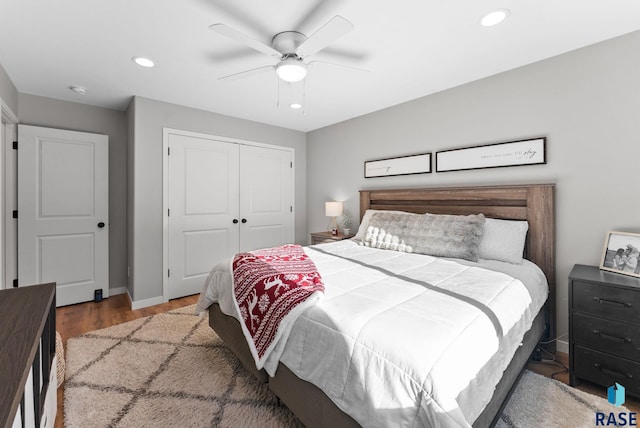 bedroom with a closet, ceiling fan, and hardwood / wood-style flooring