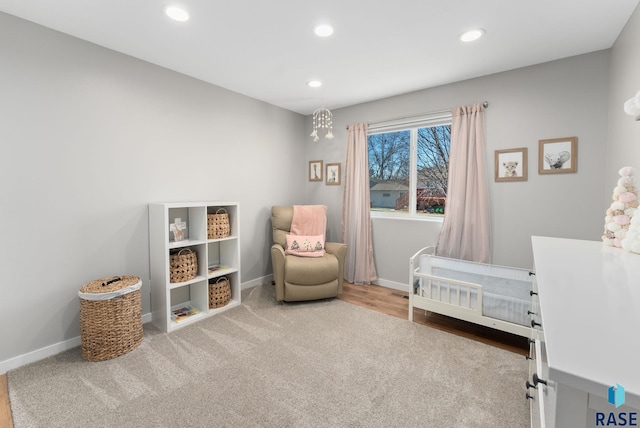 carpeted bedroom with a crib