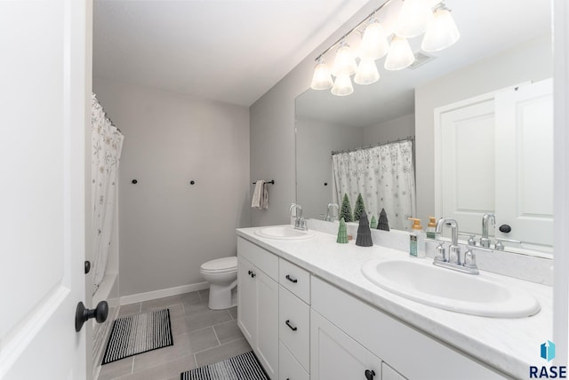 bathroom with curtained shower, tile patterned flooring, vanity, and toilet