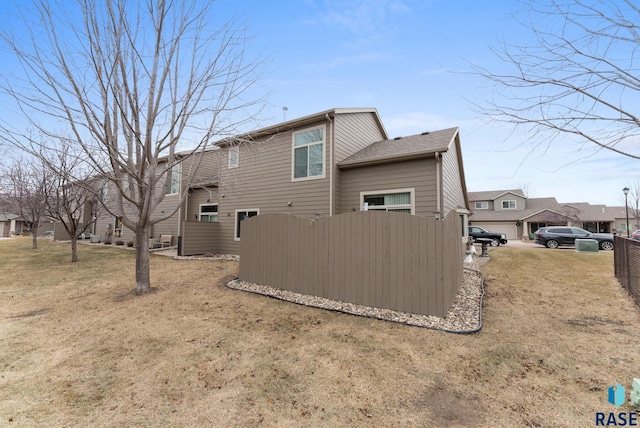 view of property exterior featuring a lawn