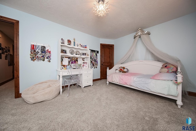 carpeted bedroom featuring a textured ceiling