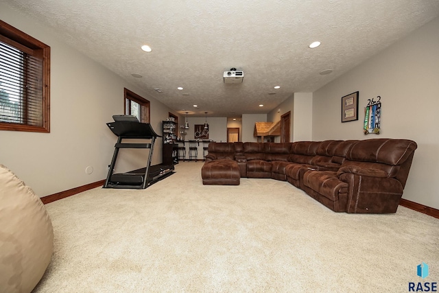 carpeted living room with a textured ceiling