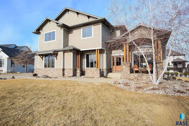 craftsman house with a front lawn