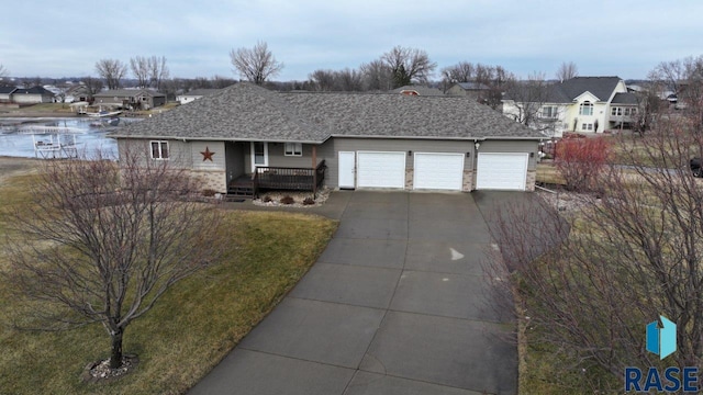 single story home with a porch and a garage