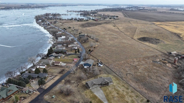 drone / aerial view featuring a rural view and a water view